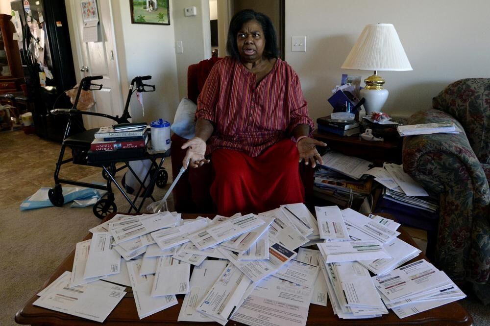 2Debra Smith with bills.jpeg